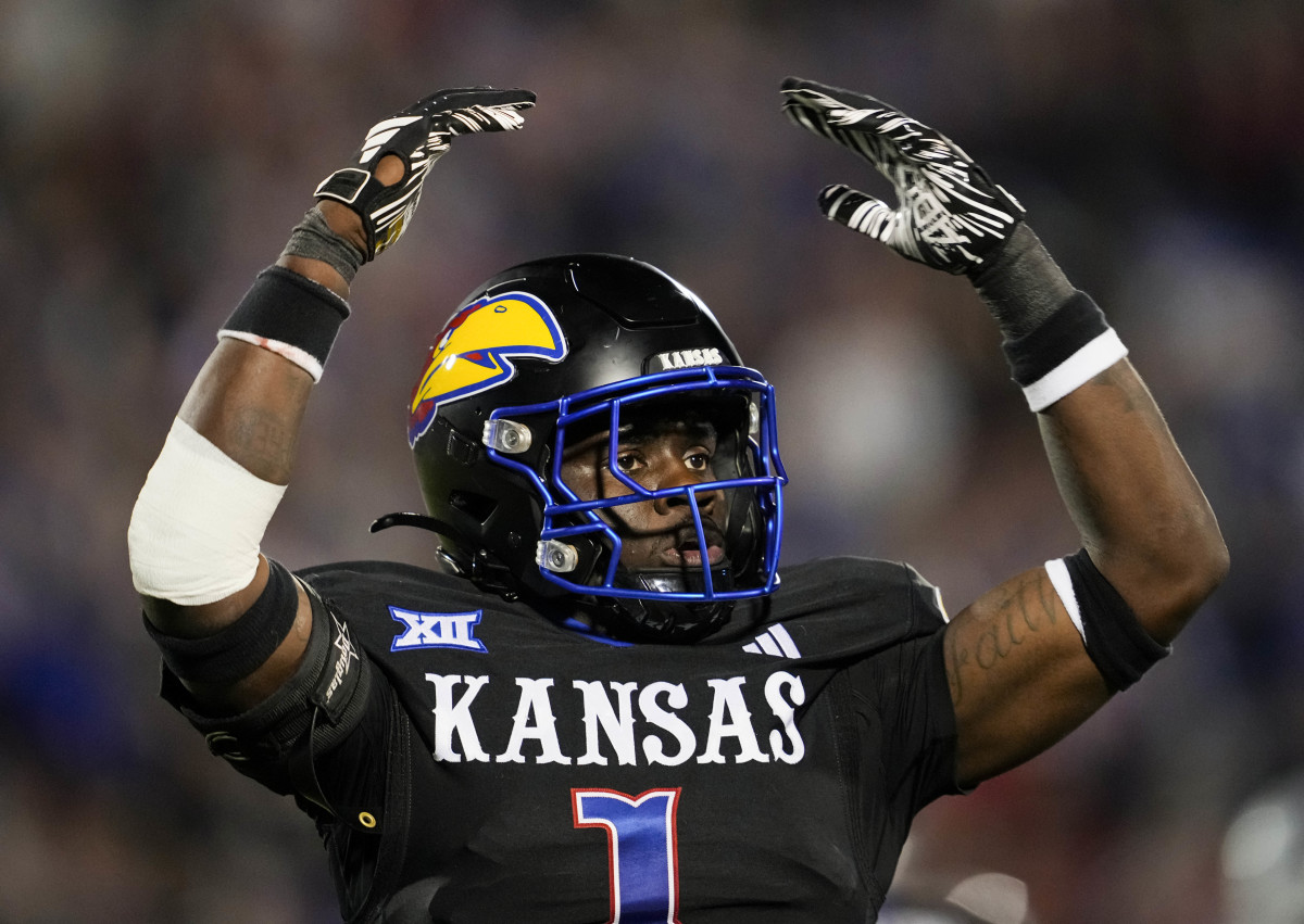 Kansas Jayhawks safety Kenny Logan Jr. (1) rallies the crowd.